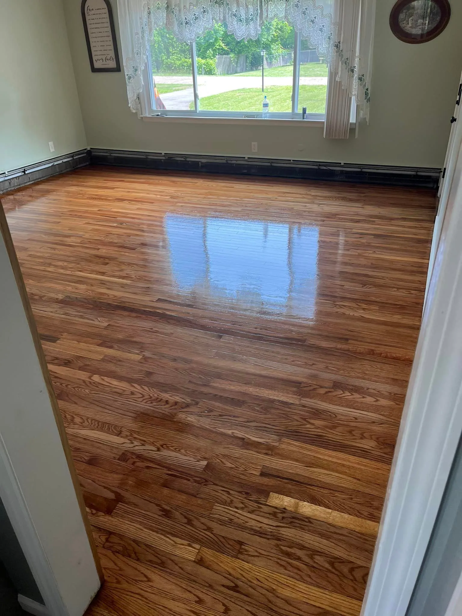 Refinished hardwood floor with fresh polyurethane